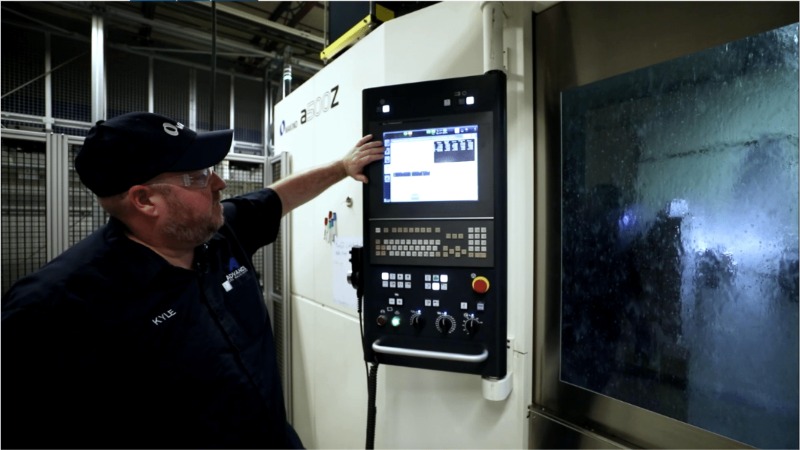 Man operating CNC Machine